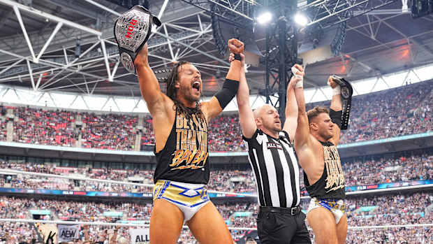 Adam Cole and MJF celebrate with the Ring of Honor tag team titles